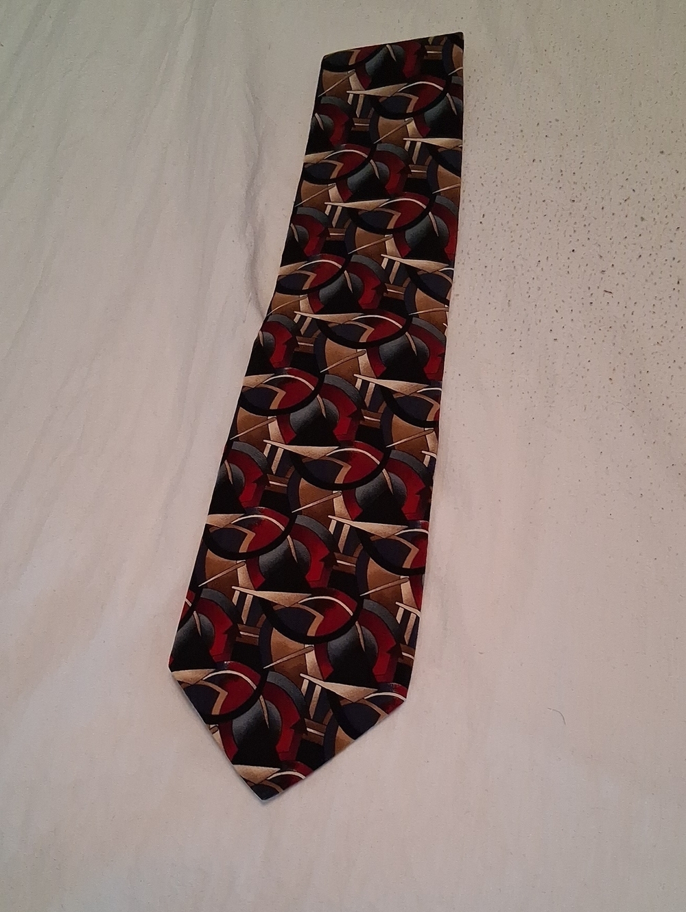 J. Garcia Men's Silk Tie in Black, Red, and Brown Abstract Geometric Pattern.